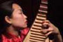 Liu Fang pgoto with pipa, Chinese guitar